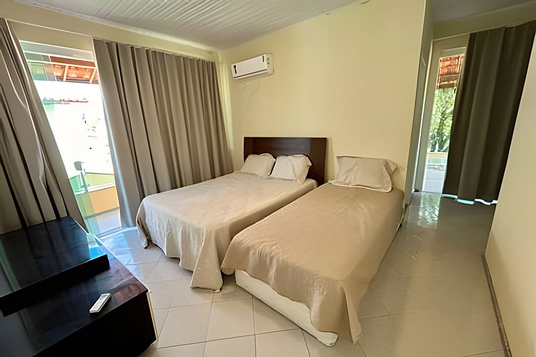 Casa 4/4 c/ AR e piscina em condomínio frente mar